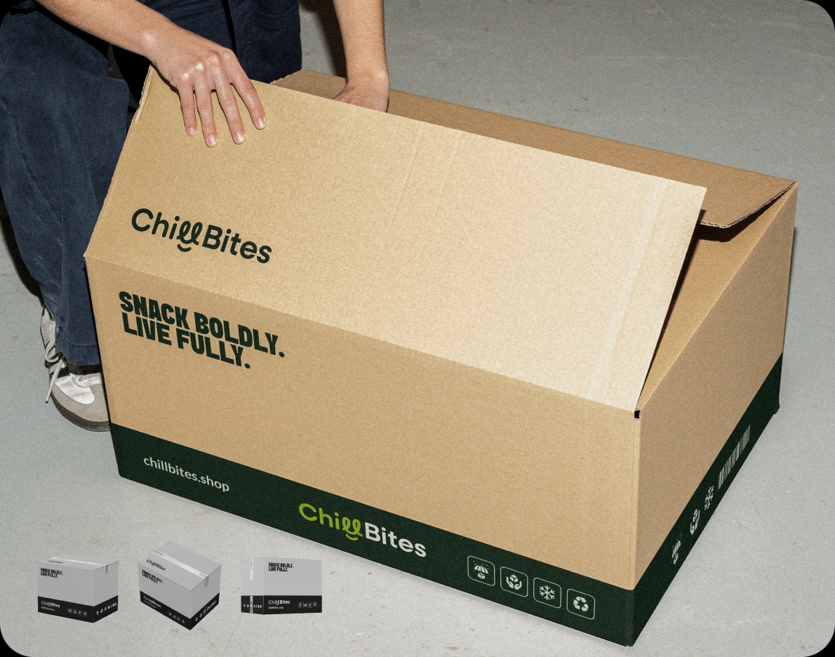 Someone opening a kraft ChillBites shipping box printed with the logo and 'Snack Boldly. Live Fully.'