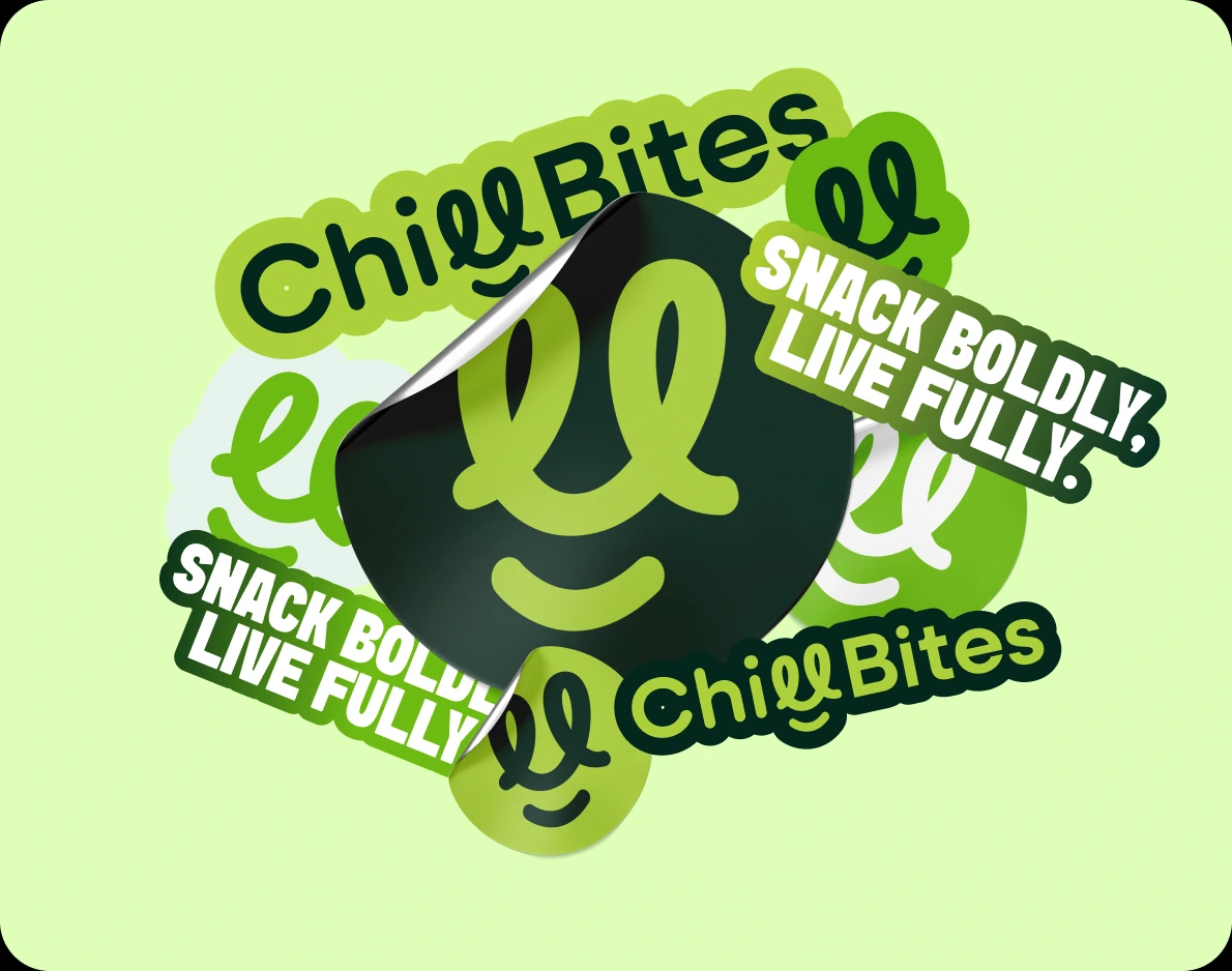 A pile of ChillBites stickers: the wordmark, the smile mark and 'Snack Boldly, Live Fully.' with a peeling dark sticker on top